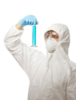 Scientist in protective wear and glasses looking at flask with reagent