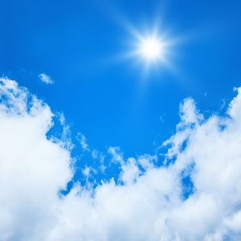 An image of a bright blue sky sun background