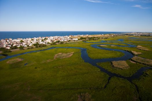 Aerial view of green field and river