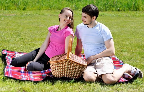Couple on picnic at sunny day            