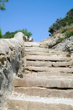 Ladder from a light stone in mountains