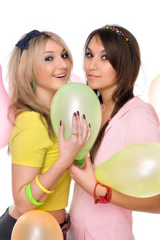 Sexy brunette and blonde holding a balloon