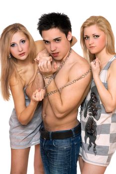 Two beautiful girls and a guy in chains