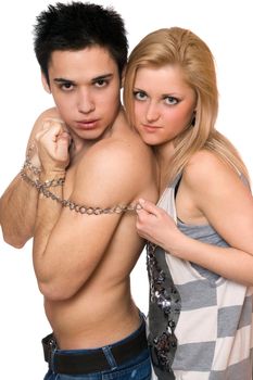 Playful young woman and a guy in chains