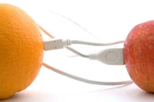 The orange and apple are connected through a cable 1