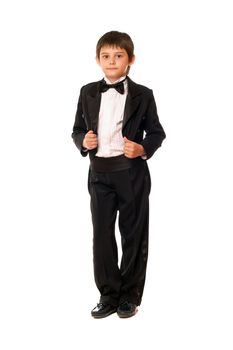 Handsome little boy in a tuxedo. Isolated on white