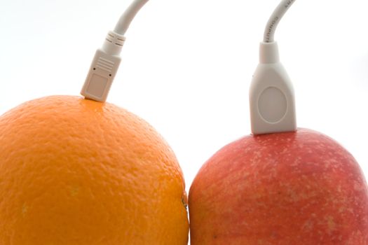 The orange and apple are connected through a cable 3