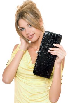 Portrait of smiling young blonde with a handbag in hands