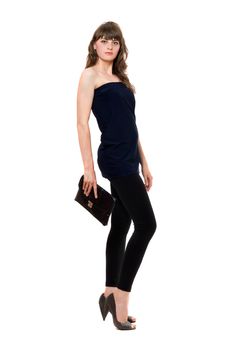 Beautiful girl in black leggings with a handbag. Isolated