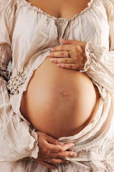 Pregnant woman belly close up