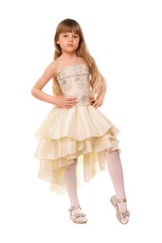 Pretty little girl in a beige dress. Isolated
