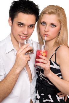 Young couple with cocktails. Isolated on white