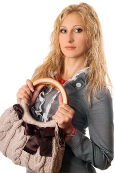 Portrait of attractive young blonde with a handbag