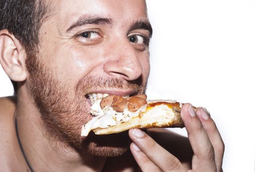 Close-Up Of A Man Eating A Slice Of Pizza with mozzarella and sausages.