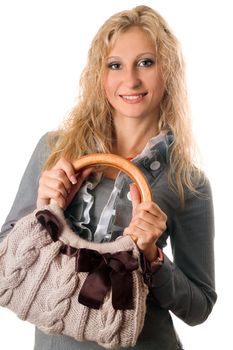 Portrait of beautiful blonde with a handbag