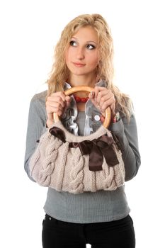 Portrait of attractive blonde with a handbag. Isolated