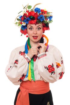 Portrait of surprised woman in the Ukrainian national clothes