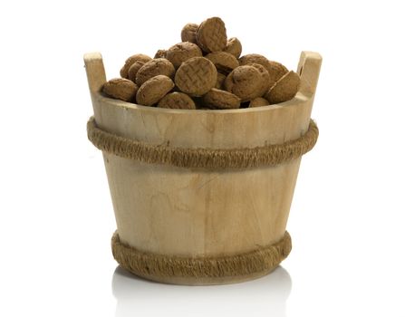 wooden sauna bucket with dutch pepernoten candy for children with sinterklaas party on 5 december