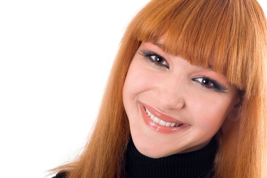 Portrait of the attractive smiling redheaded woman