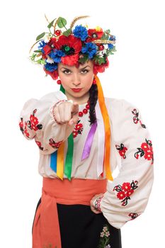Portrait of serious young woman in the Ukrainian national clothes