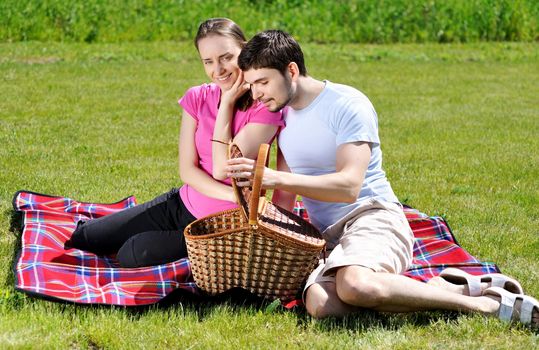 Couple on picnic at sunny day            