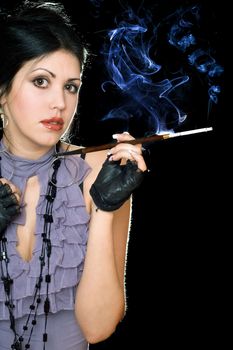 Portrait of a beautiful brunette with cigarette holder