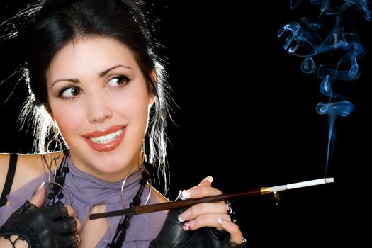 Portrait of a attractive brunette with cigarette holder