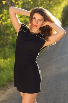 Portrait of a lovely young woman in black dress