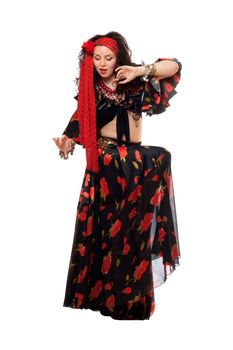 Sensual gypsy woman in a black skirt. Isolated 