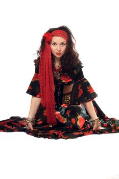 Sitting gypsy woman in a black skirt