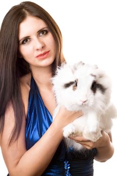 Young woman in blue dress with a rabbit