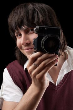 Smiling photographer with the vintage camera. Isolated