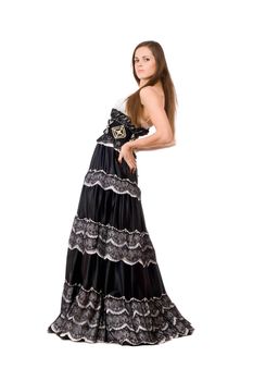 Attractive young woman in long dress. Isolated