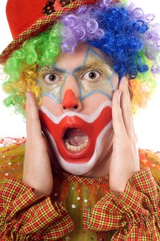 Portrait of a terrified clown. Isolated on white