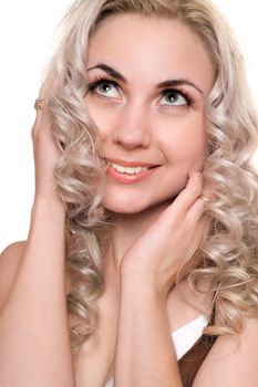 Closeup portrait of smiling young blonde. Isolated on white