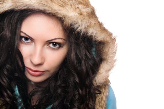 Closeup portrait of pretty young brunette in the hood