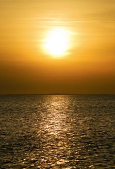 Calm sea bay at the orange sunset