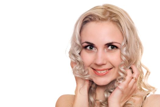 Closeup portrait of smiling young blonde. Isolated
