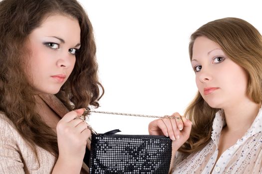 Quarrel of two beautiful girls because of a handbag