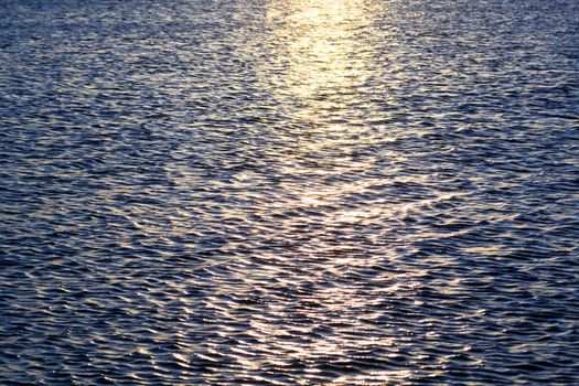 Sun reflexion in a dark blue sea surface