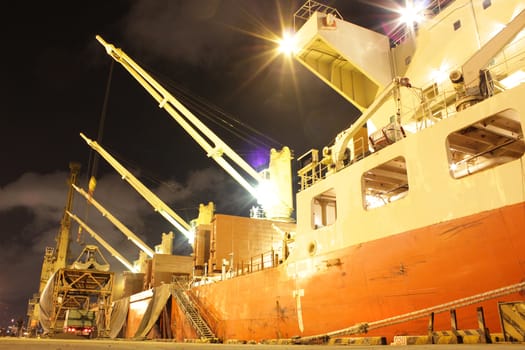 Cargo jetty on the night with green lighting 