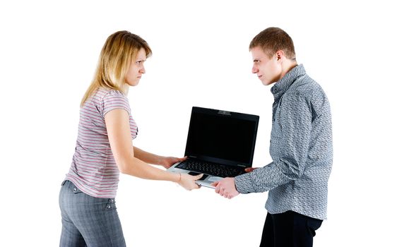 young couple takes away from each other laptop. isolated white background