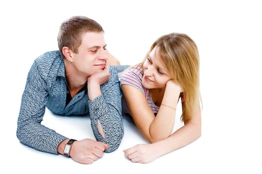 smiling girl and boy lying on the floor