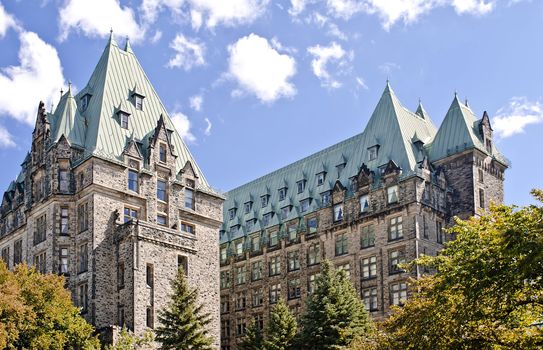 The Canadian Parliament Confederation Building seen from behind showing the 2 towers of offices for Members of Parliament in Ottawa, Canada.