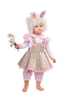 Little girl with flowers in hand wearing a dress