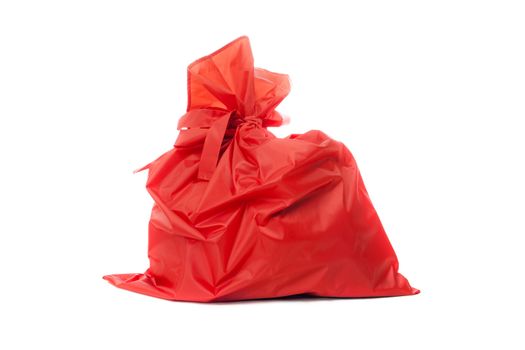 Red bag of Christmas gifts. Isolated on white