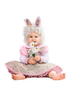 Little girl with flowers in hand wearing a dress. Isolated on white