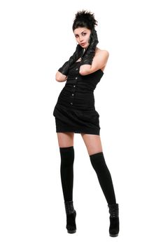 Beautiful young woman in a black dress talking on the phone