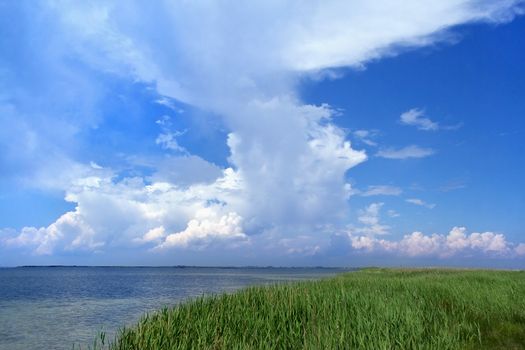 Blue sky with white clouds over the bay