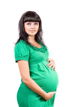 Portrait of a pregnant young woman in green dress